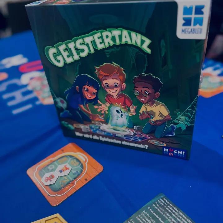 The Geistertanz box next to the game board with the ghost and candle