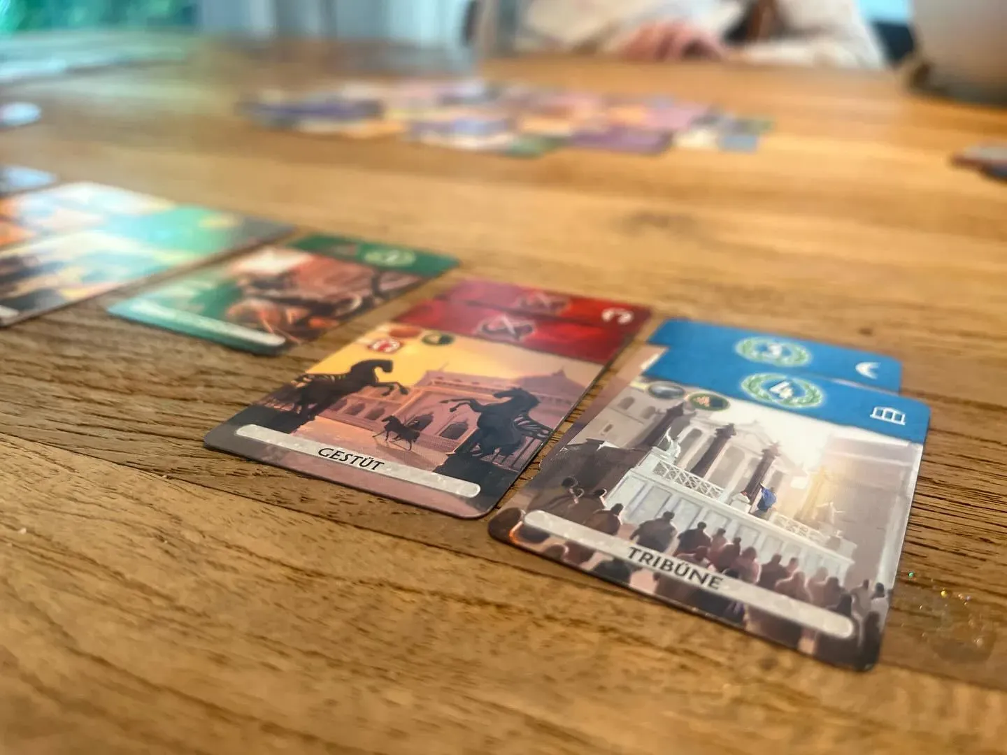 7 Wonders Duel cards laid out on our wooden table