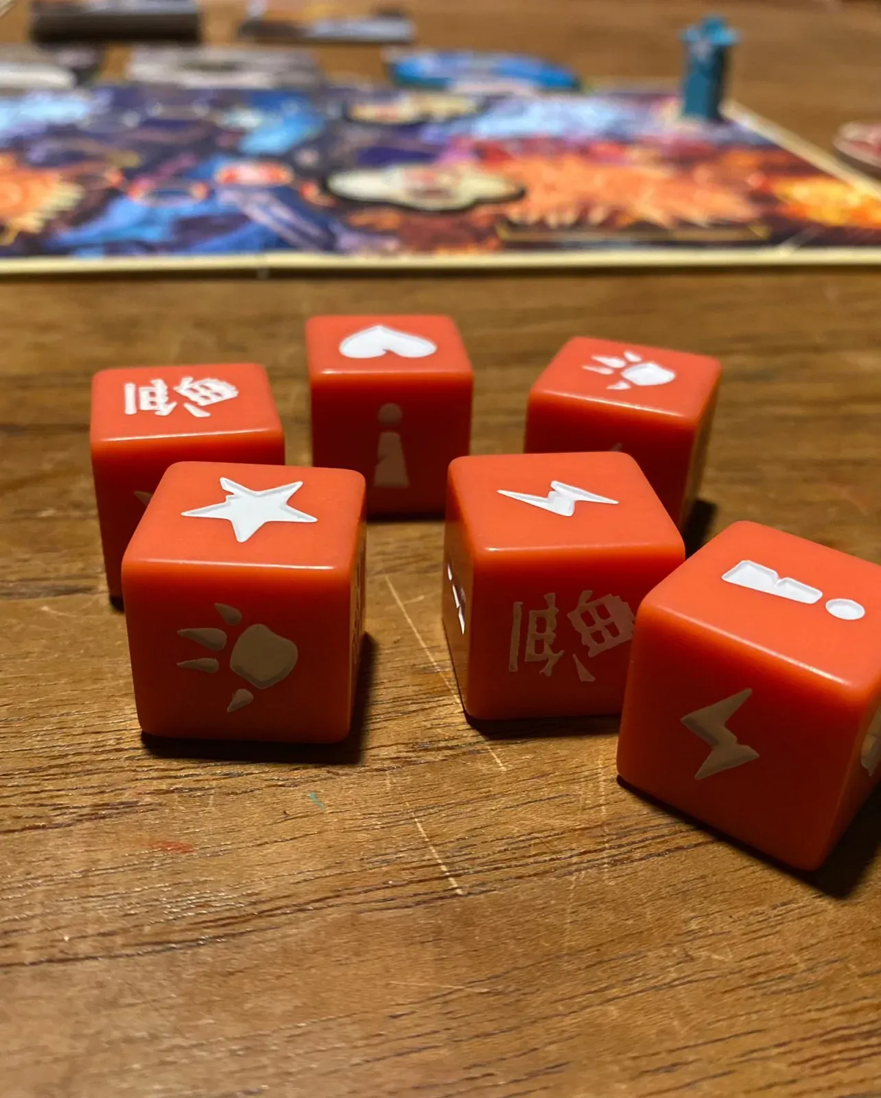 The red King of Tokyo: Duel dice on our wooden table