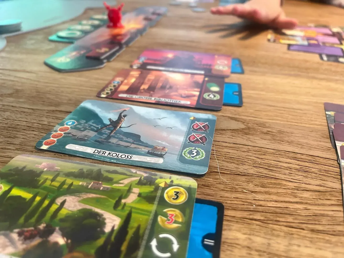 A 7 Wonders Duel wonder card next to the card pyramid